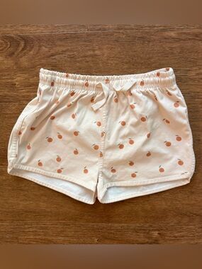 Quincy Mae Boys Swim Shorts, oranges print. Size: 4-5Y